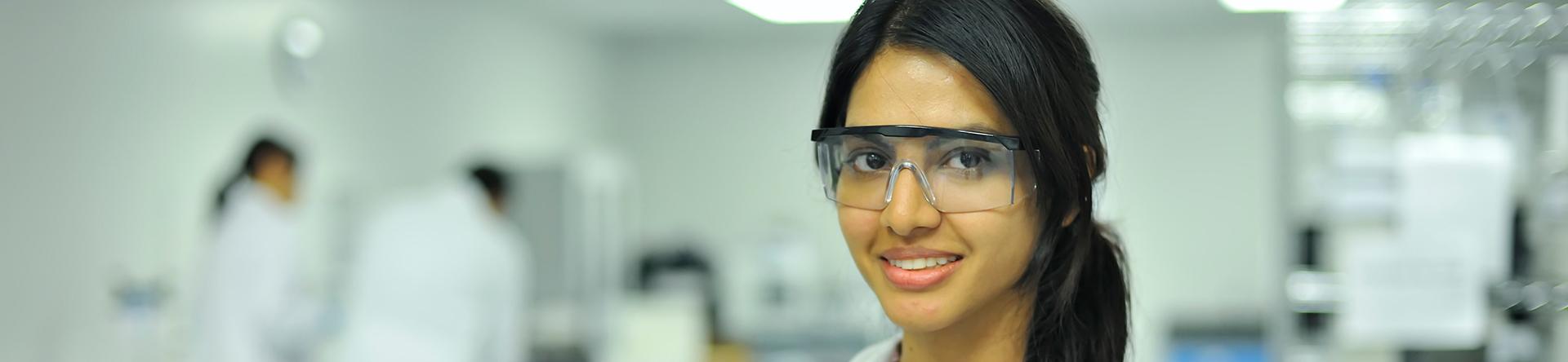 Female FAU Graduate in a lab